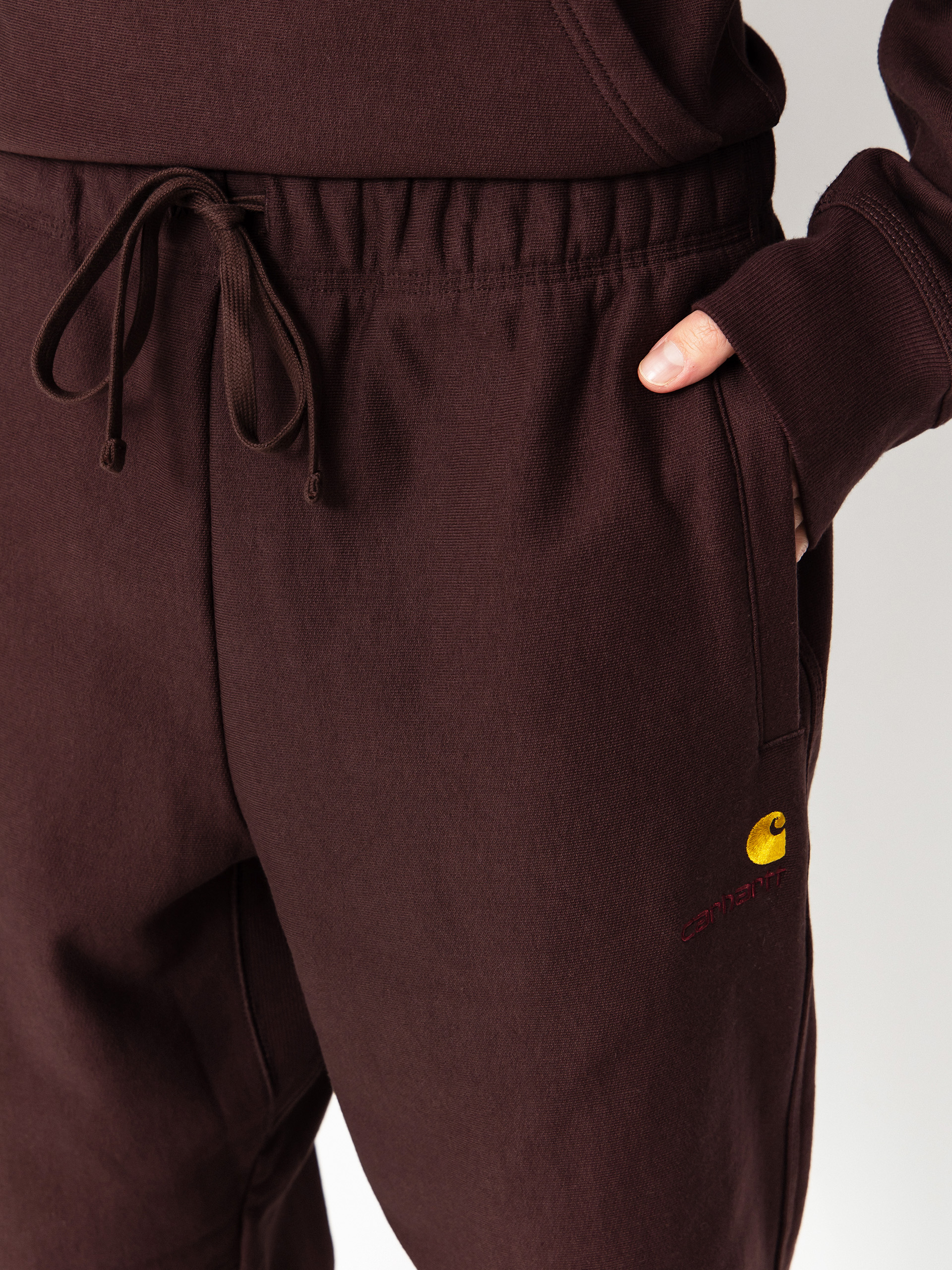 Панталони Carhartt WIP American Script Jogging (palisander)